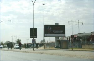 Billboards on Klipspruit Valley Road, Klipspruit Ext 318, Soweto with outdoor advertising, township, highway, urban, digital, taxi rank, prices, rates, costs, rental, woodlands and marketing
