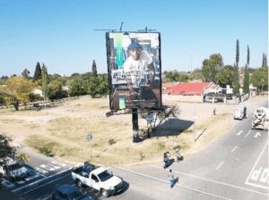 Billboards on Sekame Street Road Mafikeng Stadium with outdoor advertising, township, highway, urban, Outdoor Static, taxi rank, prices, rates, costs, rental, woodlands, and marketing