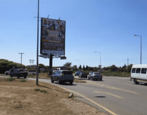 Billboards on Dr Albert Luthuli Road Mahikeng with outdoor advertising, township, highway, urban, Outdoor Static, taxi rank, prices, rates, costs, rental, woodlands, and marketing
